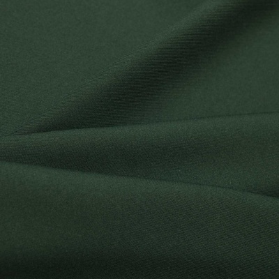 Ткань костюмная 21010 2076, 225 гр/м2, шир.150см, цвет т.зеленый - купить в Магнитогорске. Цена 390.73 руб.